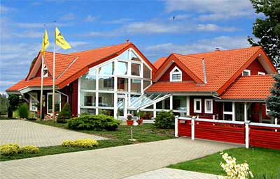LéonWood Musterhaus Blockhaus Château M Außenansicht