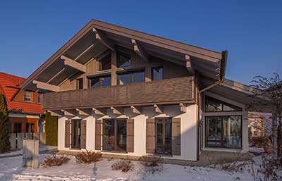 Isartaler Holzhaus Musterhaus Tegernsee mit Wintergarten