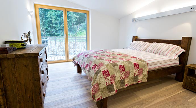 Gruber NaturHolzHaus Passivhaus England Schlafzimmer