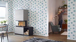 Die moderne und puristische Sichtbetonverkleidung „Artstone Naturell“ verleiht dem Heizeinsatz eine kühle Eleganz.